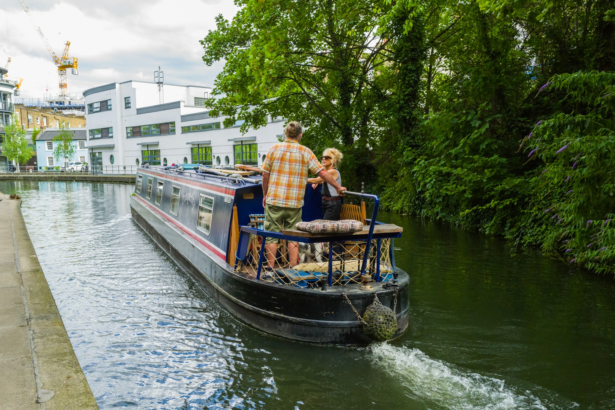 Colorful narrowboats moored along Regent's Canal in London, United Kingdom