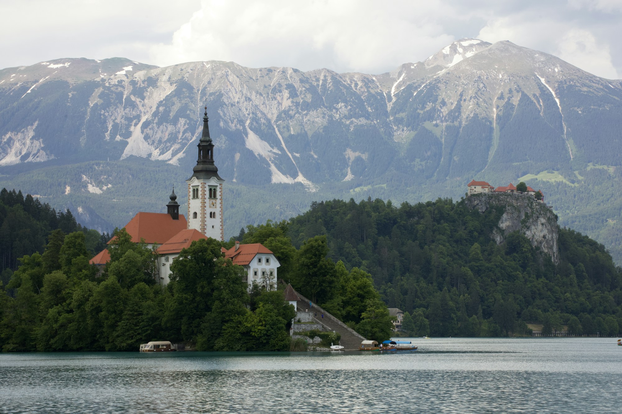 Panoramic view of Lake Bled surrounded by mountains in Slovenia