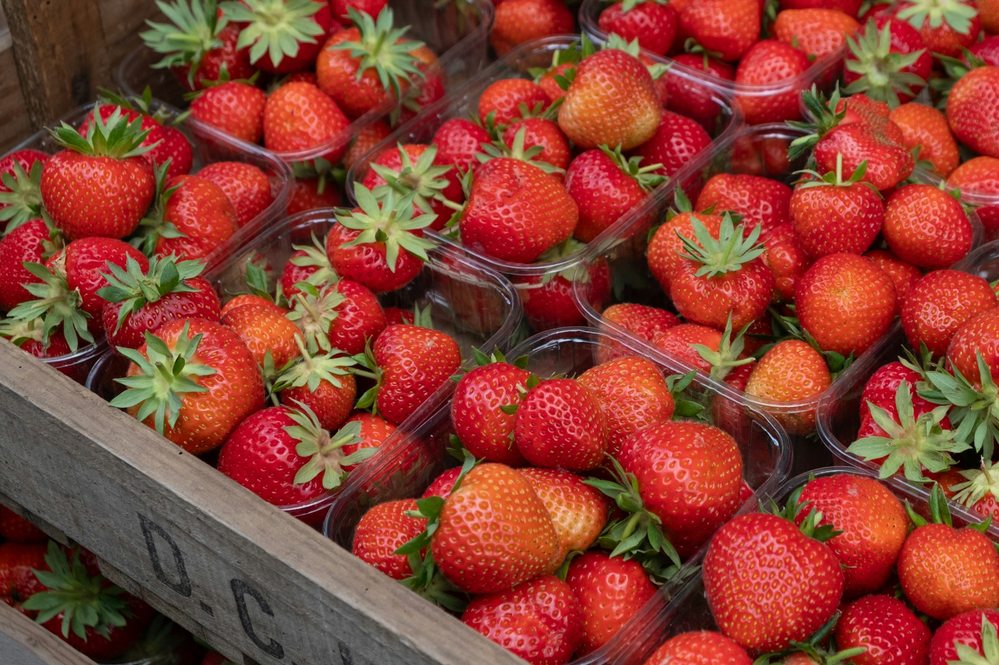 Fresh English strawberry punnets displayed at a British greengrocer