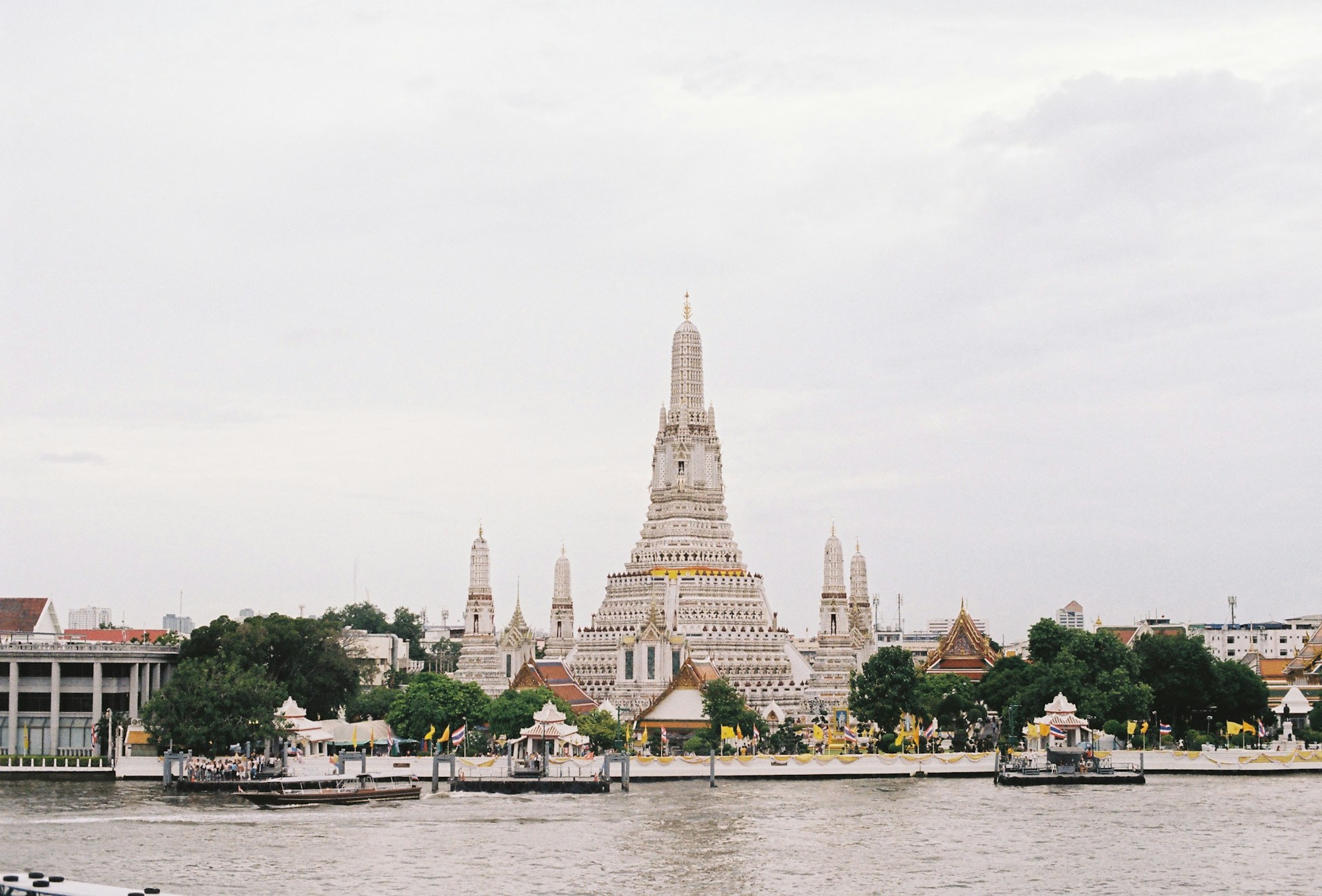 Wat Arun temple on the banks of the Chao Phraya River with its distinctive towers, Bangkok, Thailand