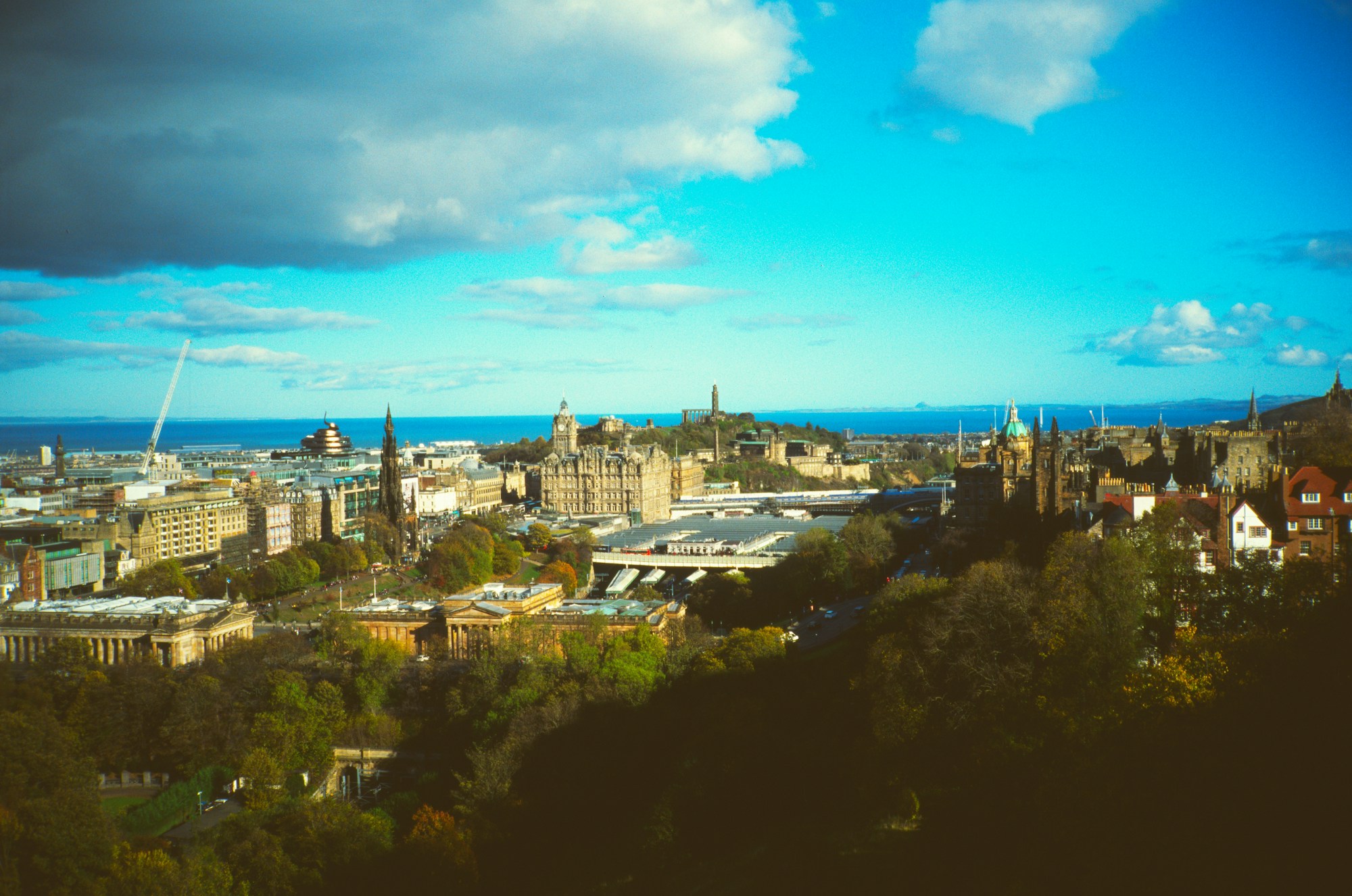 Autumn panorama of Edinburgh with the castle and spires under a dramatic sky, Scotland