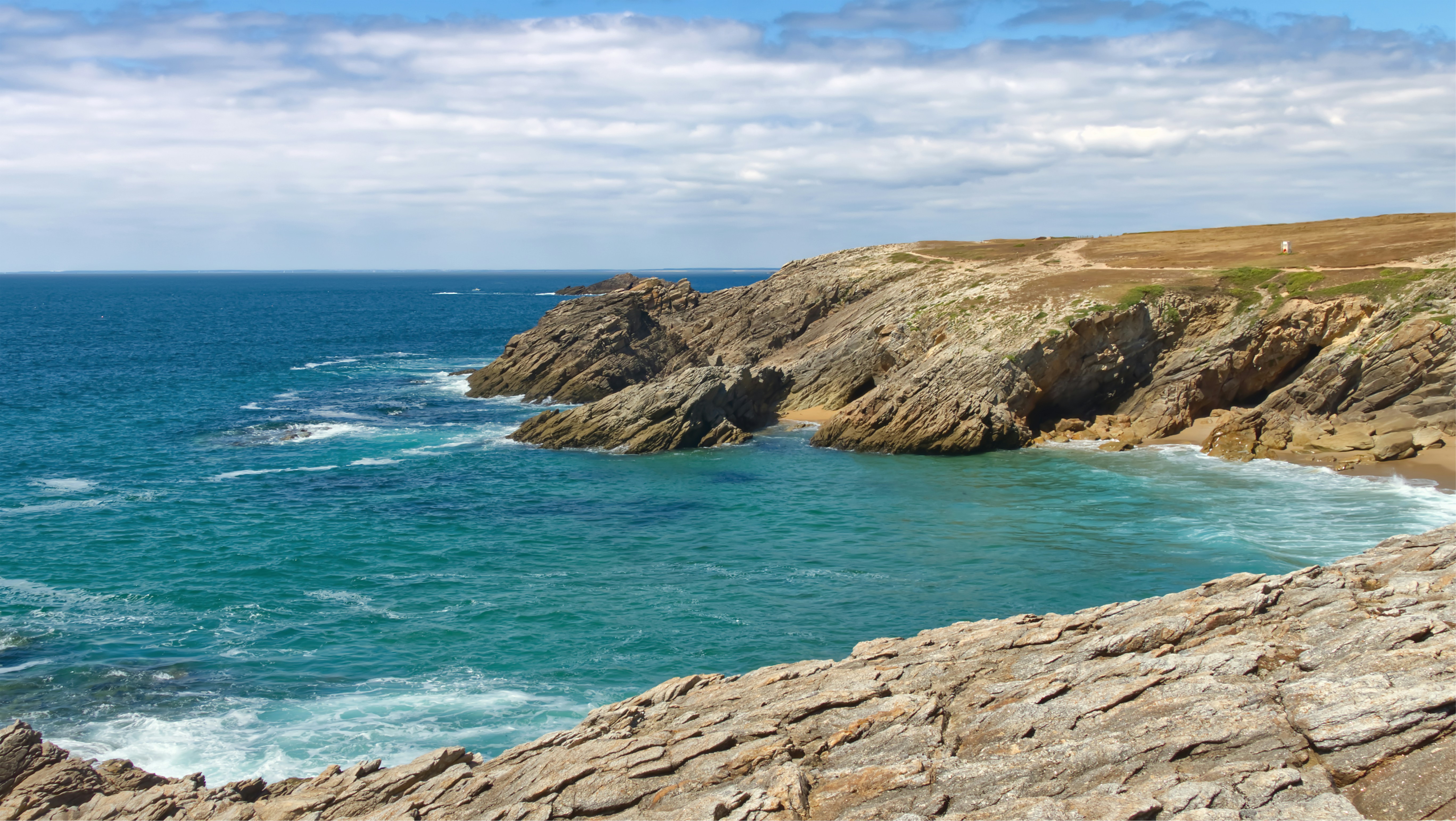 Wild coast of Quiberon in Brittany with Atlantic cliffs battered by waves
