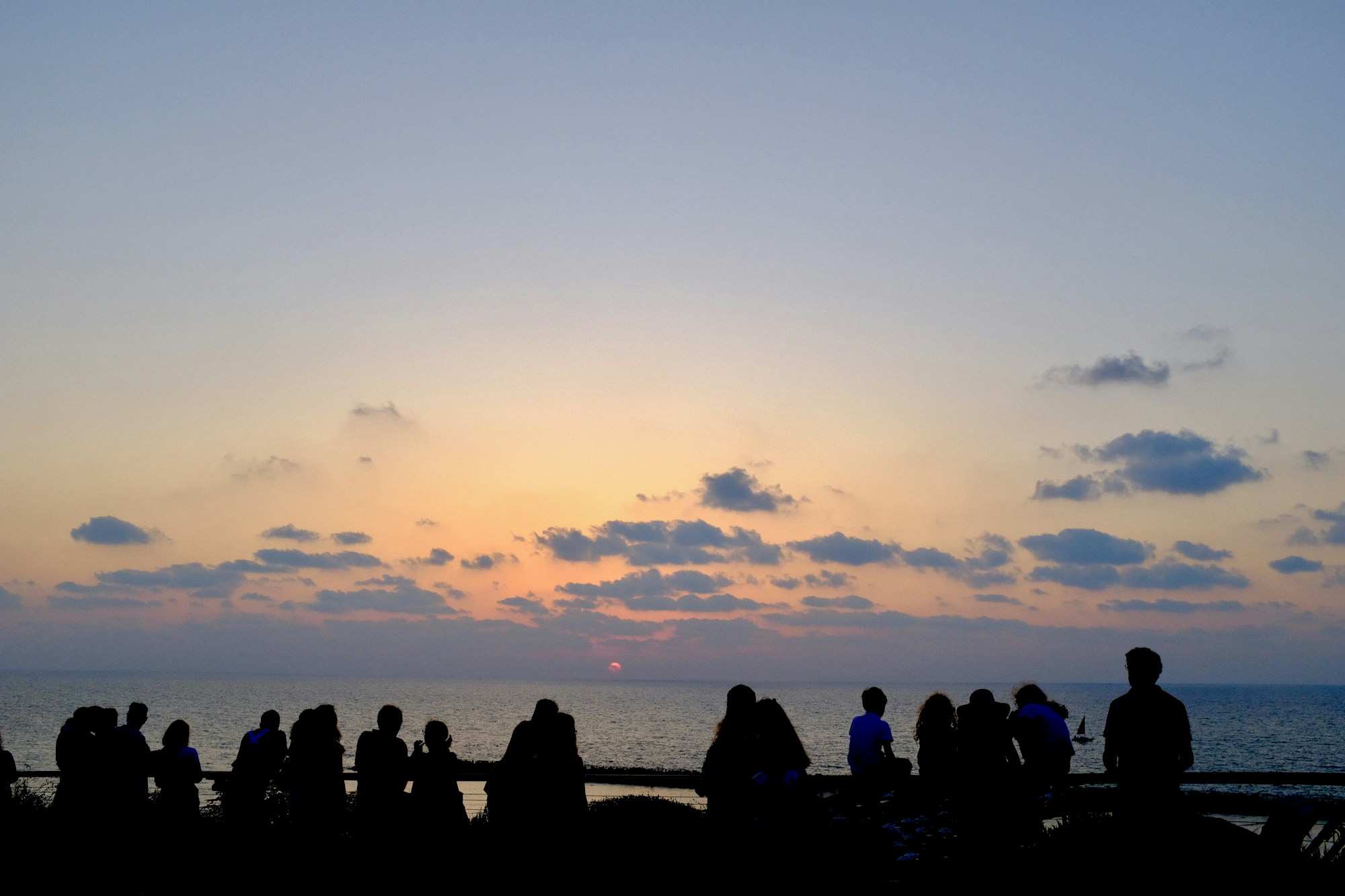 Group of people watching the sunset on Tel Aviv beach for Rosh Hashana 2026