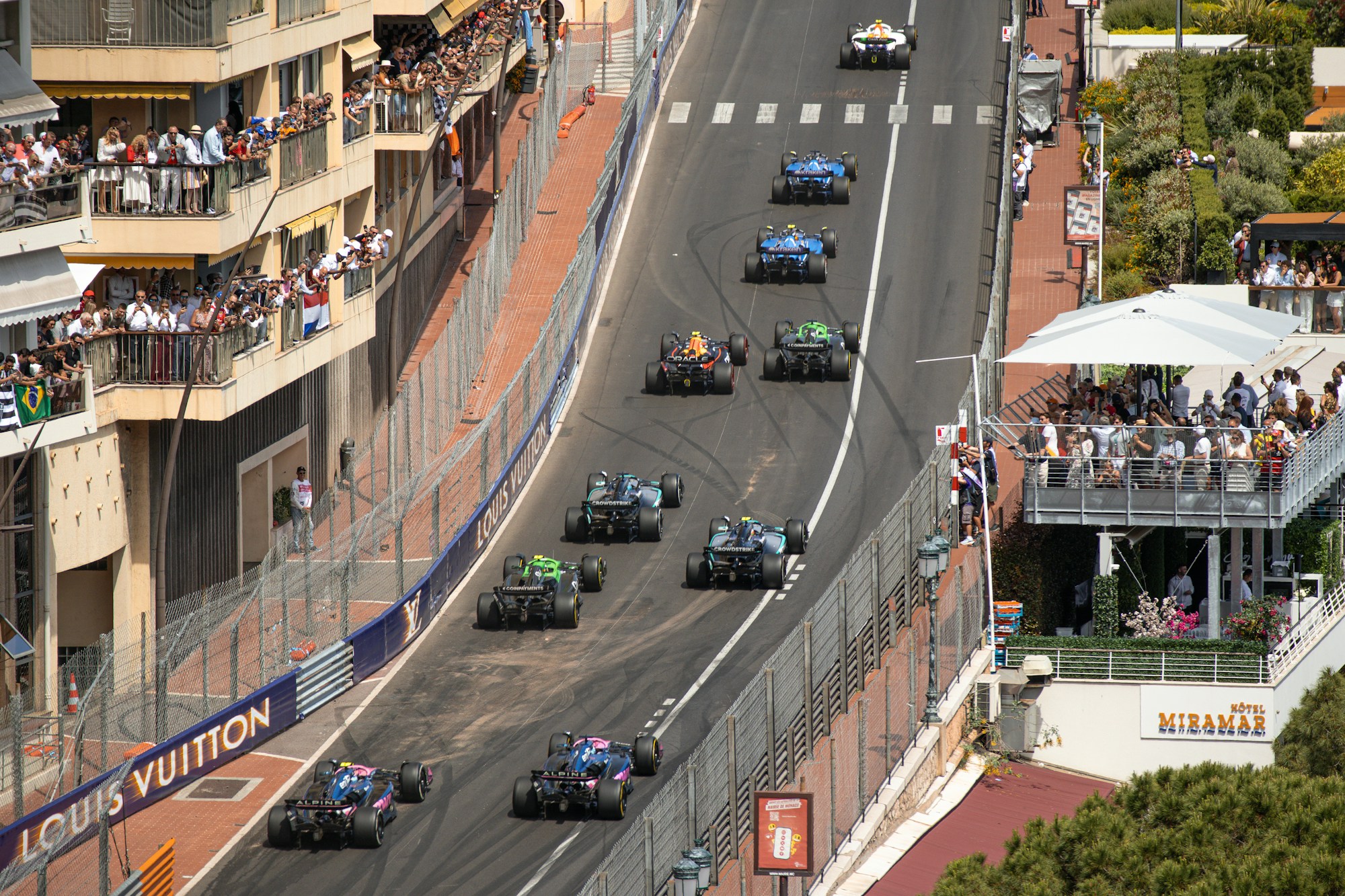 Formula 1 single-seaters racing through a tight corner