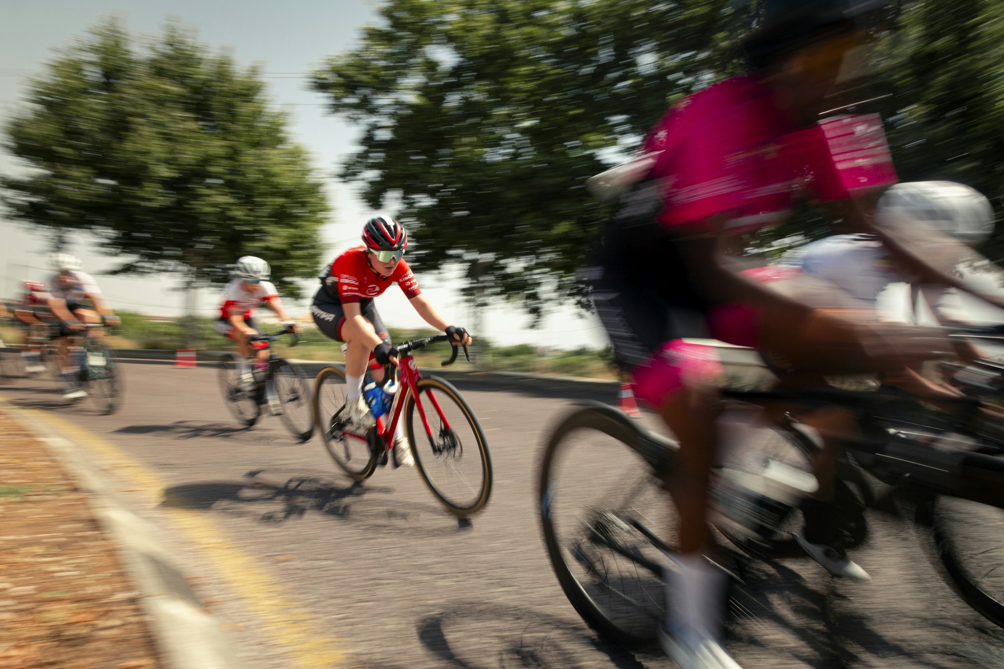 Cycling peloton racing on a road in France during the Tour de France