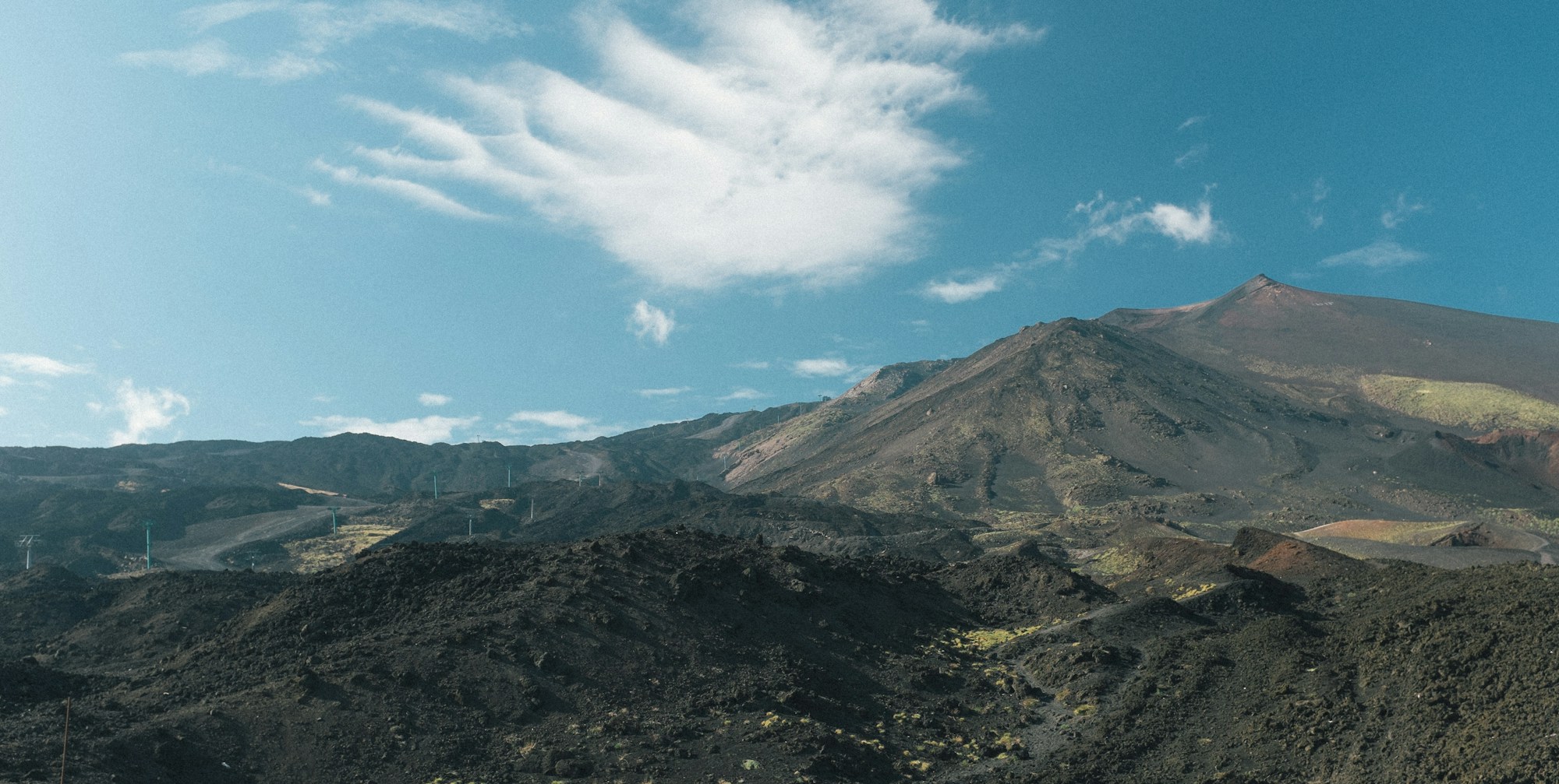 Mount Etna volcano in Sicily under a Mediterranean blue sky in autumn
