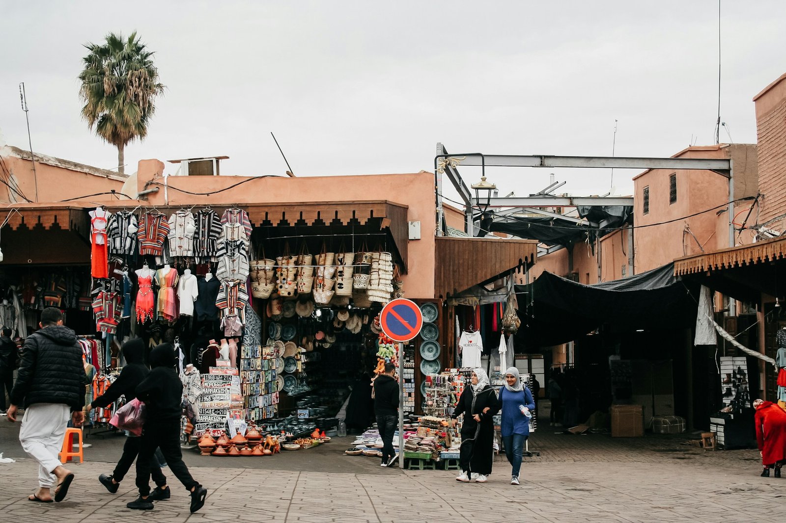 Busy market in the Marrakech medina with colourful lanterns and spices
