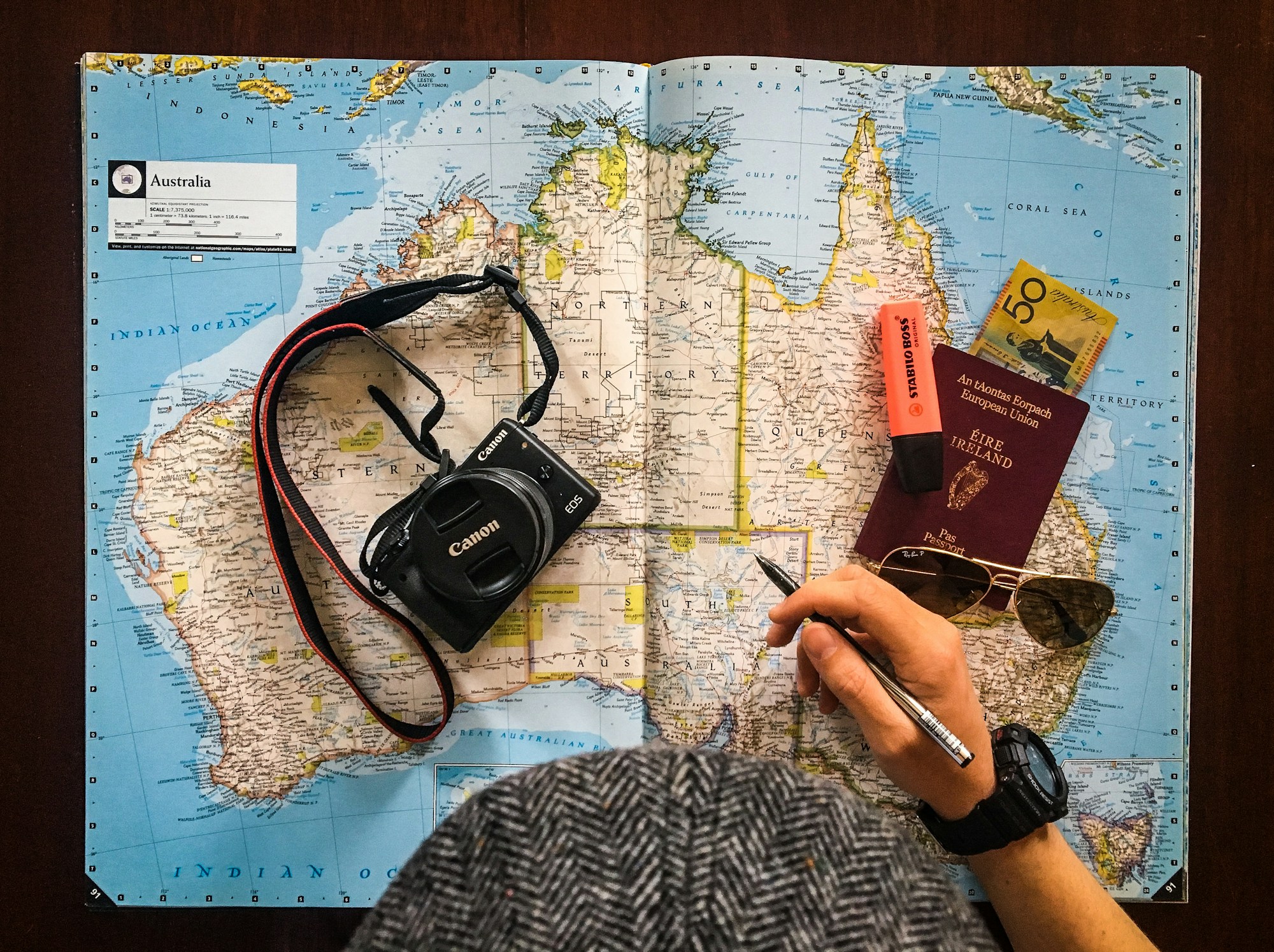 Passport and travel documents on a world map