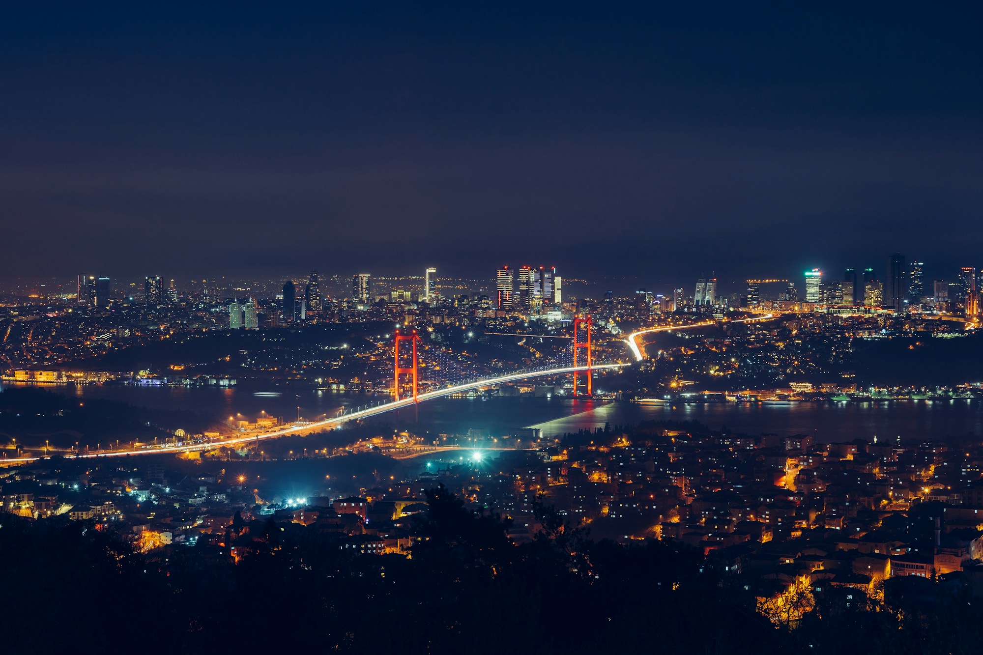 Aerial view of Istanbul at night, illuminated city and the Bosphorus