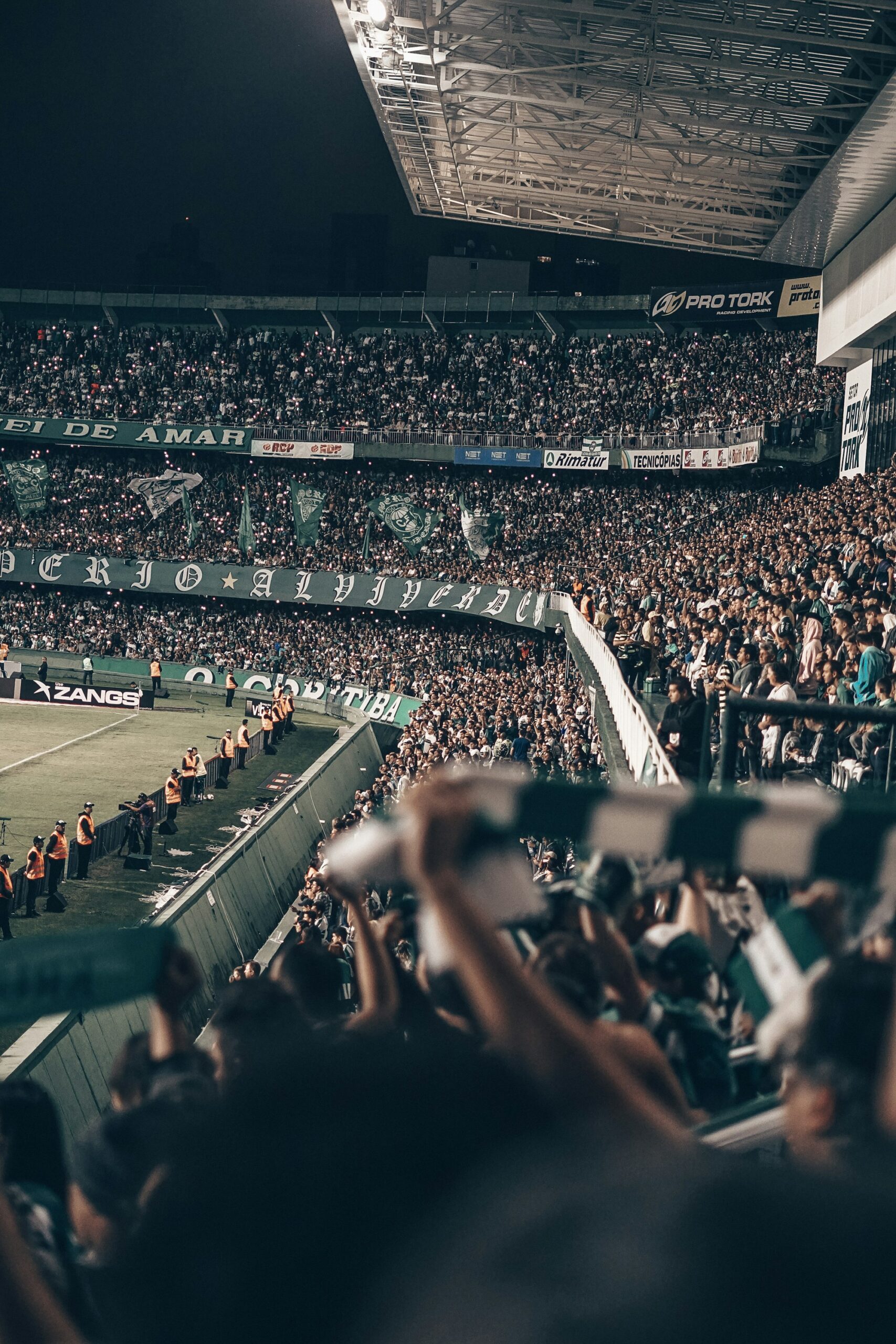 Aerial view of a large stadium at night during an international football match