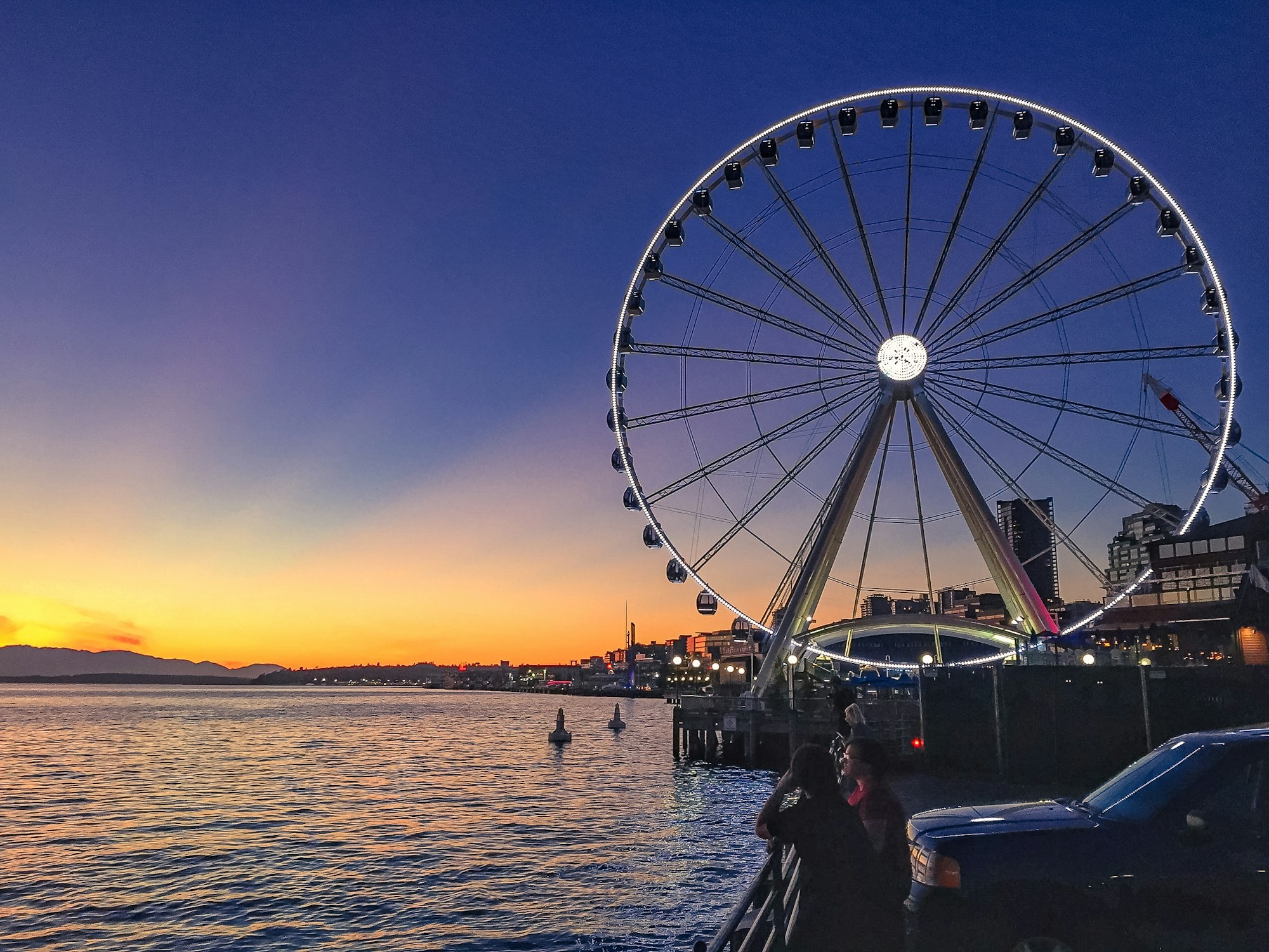 Seattle waterfront with an event stage on the water — floating Fan Zone for the 2026 FIFA World Cup