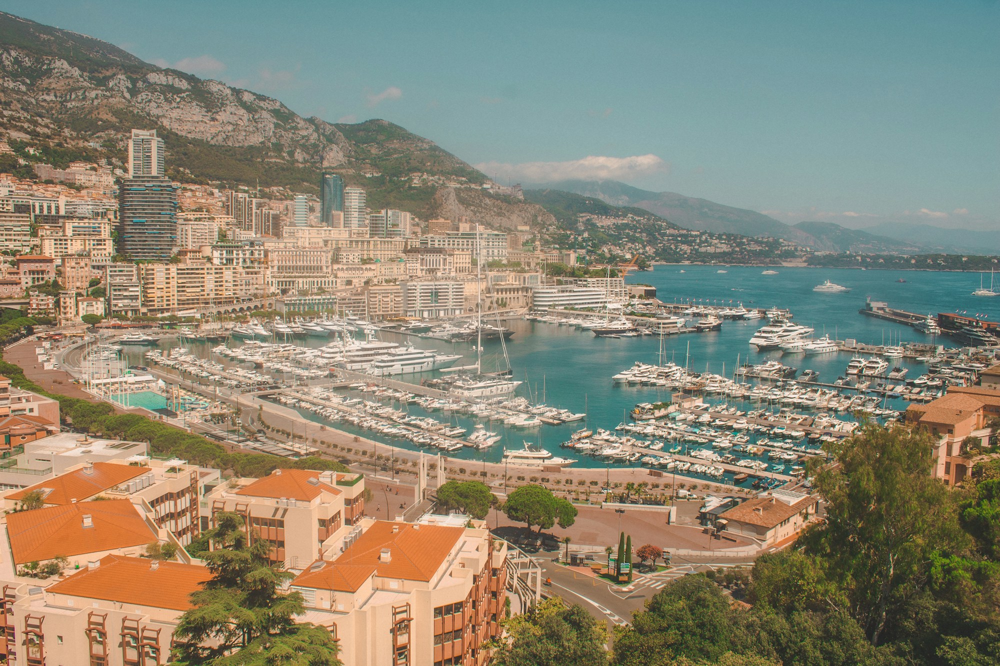 Port Hercule in Monaco with luxury yachts and Monte-Carlo skyline