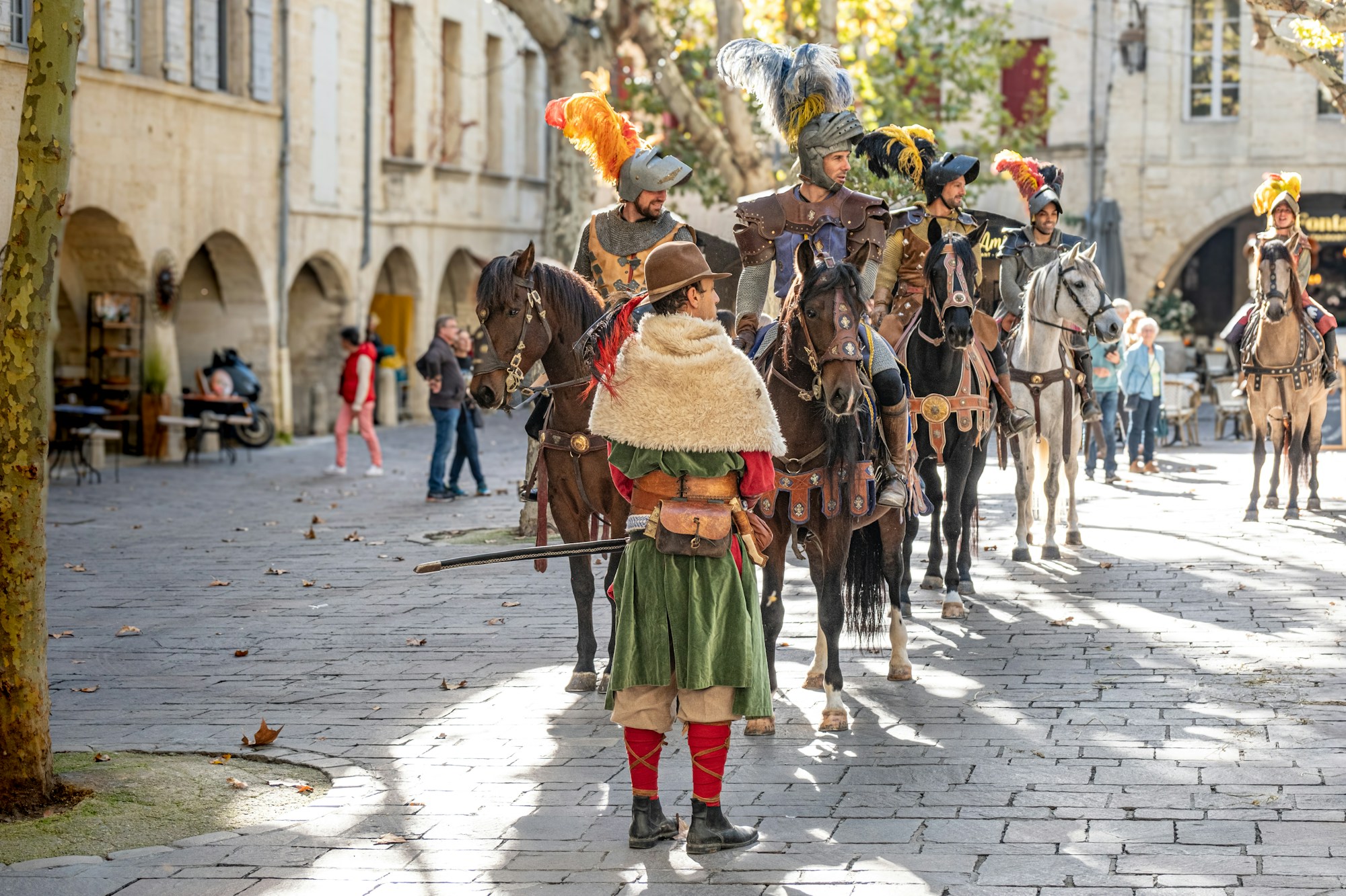 Reenactment of medieval knights in period costume during a historical parade in France