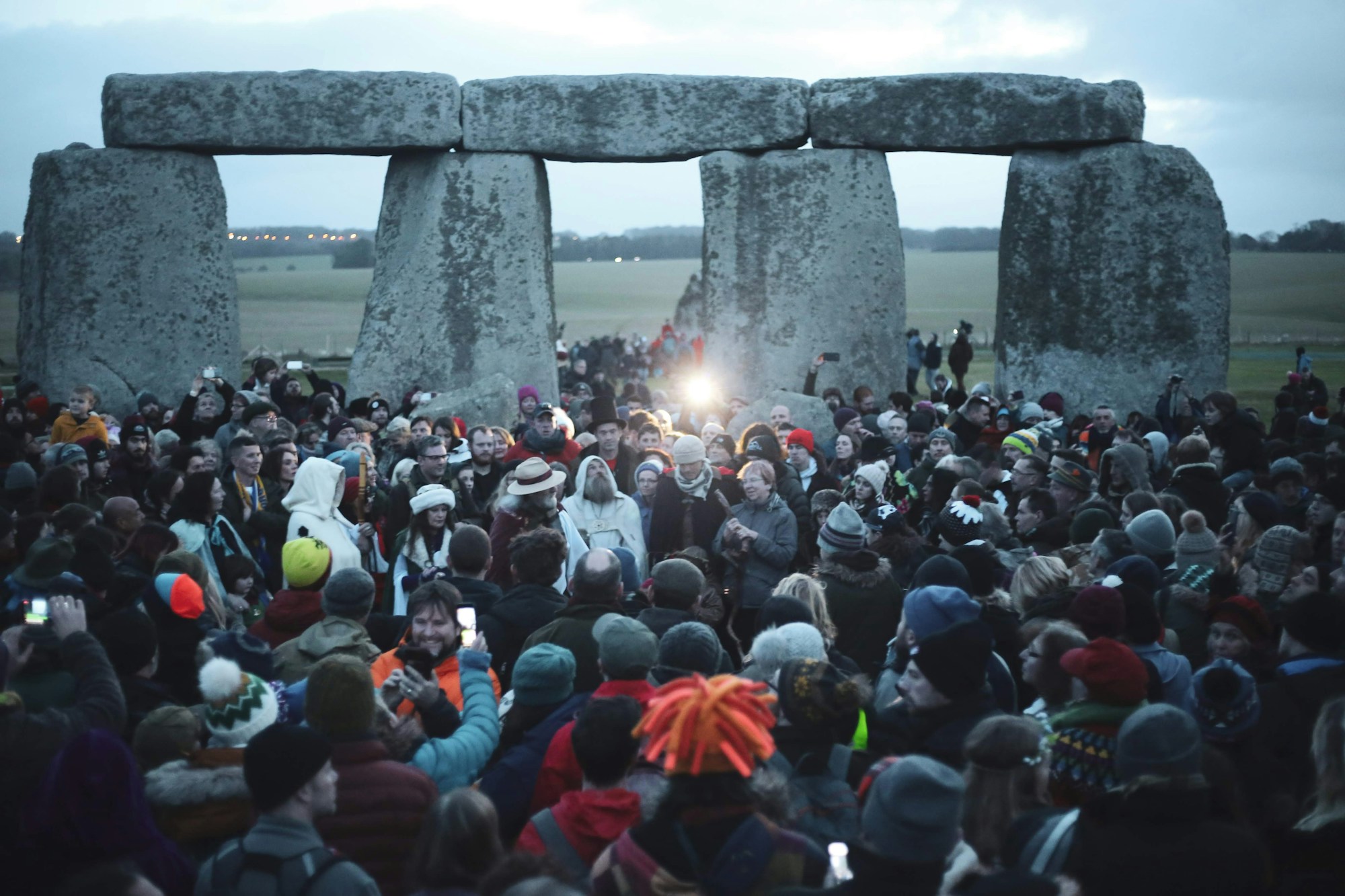 Crowd gathered at Stonehenge at sunrise for the summer solstice celebration