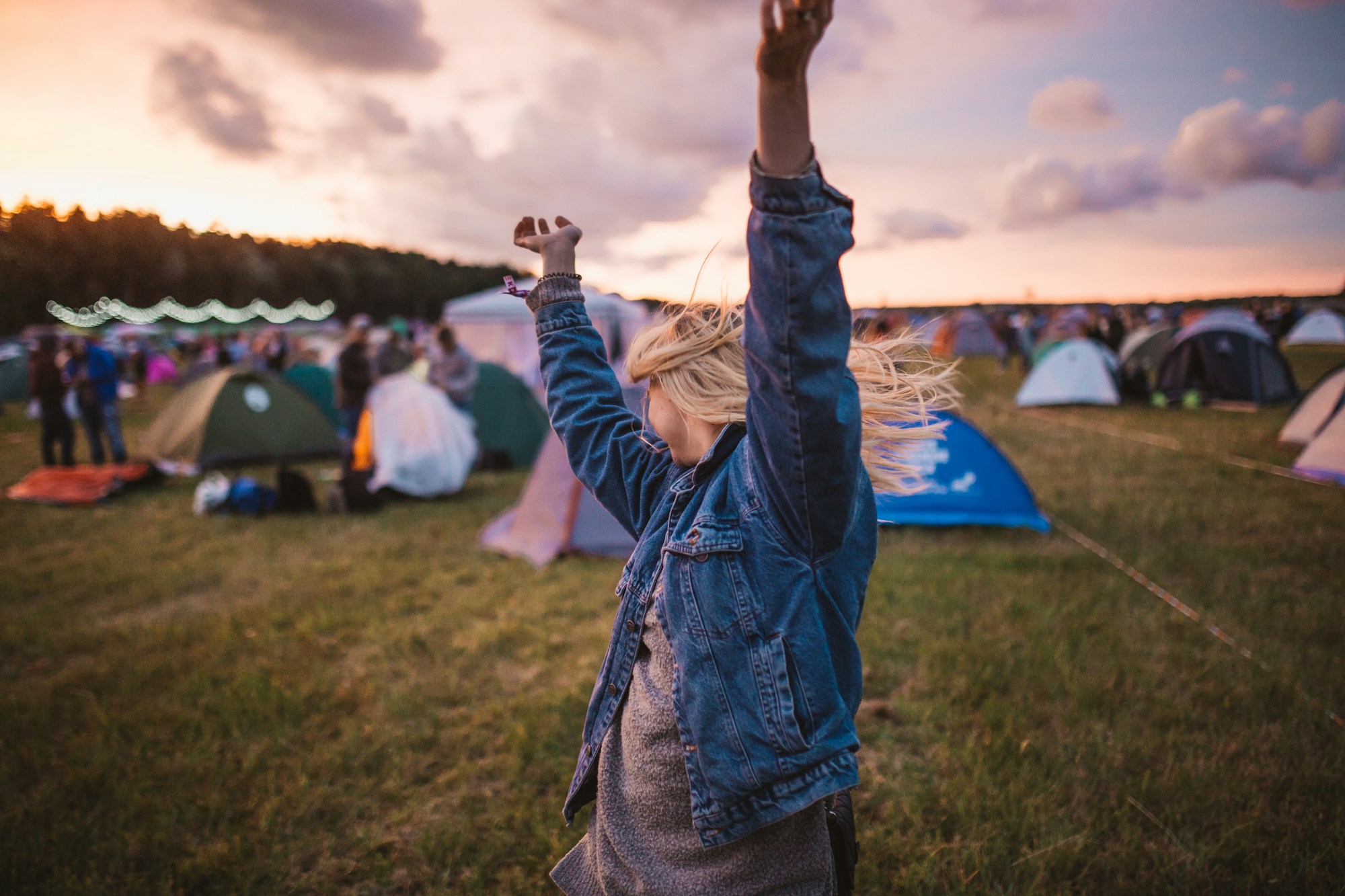 Eco-friendly outdoor music festival surrounded by green spaces