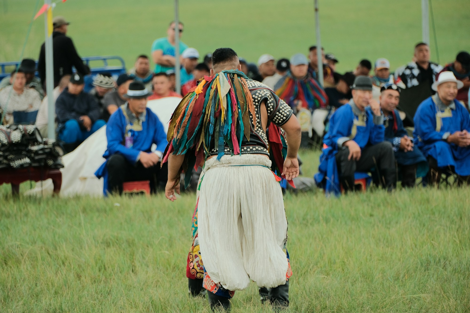 Mongolians in embroidered traditional deel robes at the Naadam festival