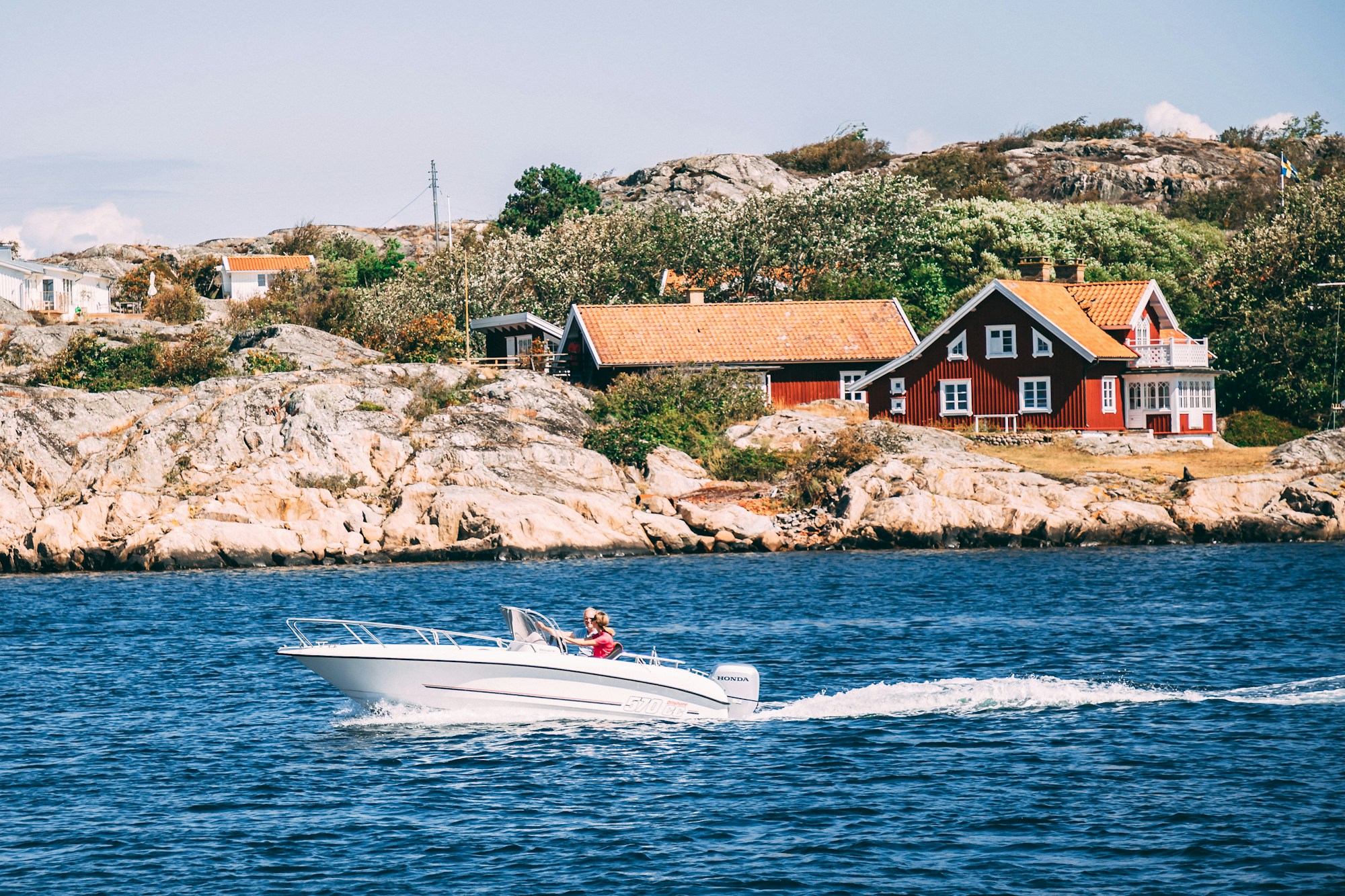 The Swedish seaside resort of Båstad on the Kattegat coast, colourful houses and leisure boats