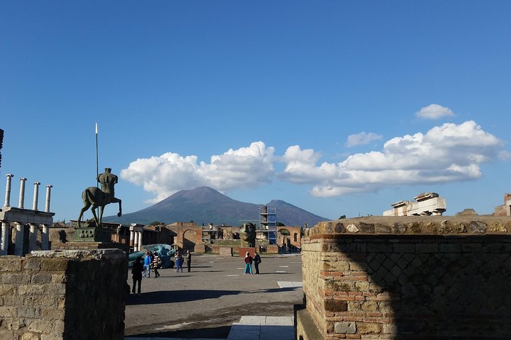 Archaeologist guiding a tour of the Pompeii excavations in recently uncovered areas
