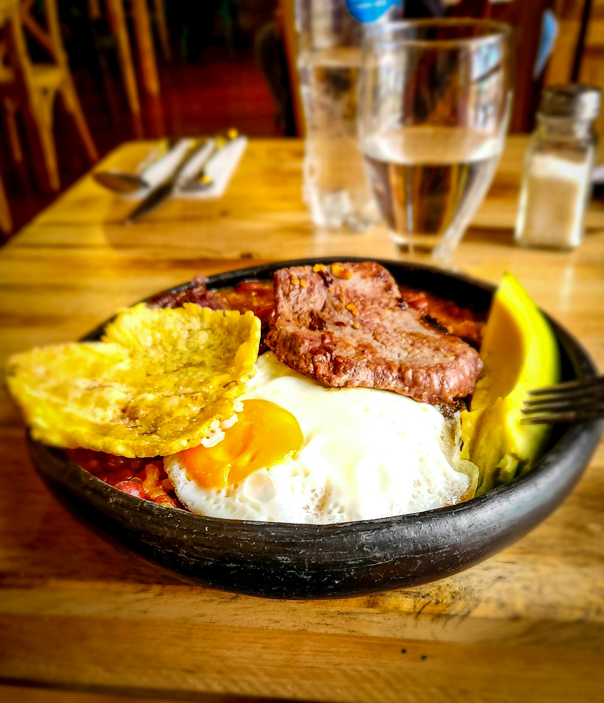Bandeja paisa, the traditional Antioquian dish served on a platter with beans, rice, meat, and arepa