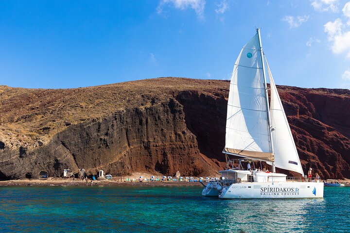 Private catamaran off the coast of Santorini for an exclusive cruise