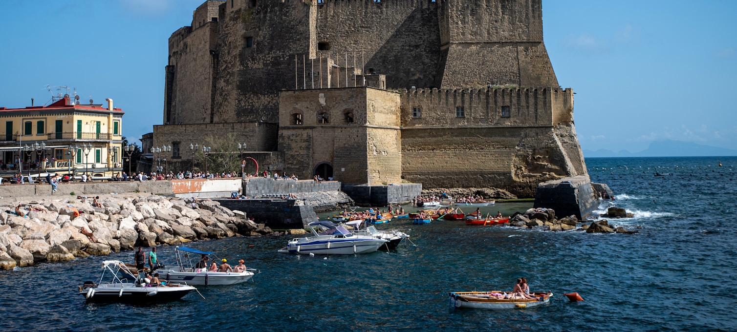 The Via Caracciolo waterfront in Naples, with Castel dell'Ovo and the gulf in the background