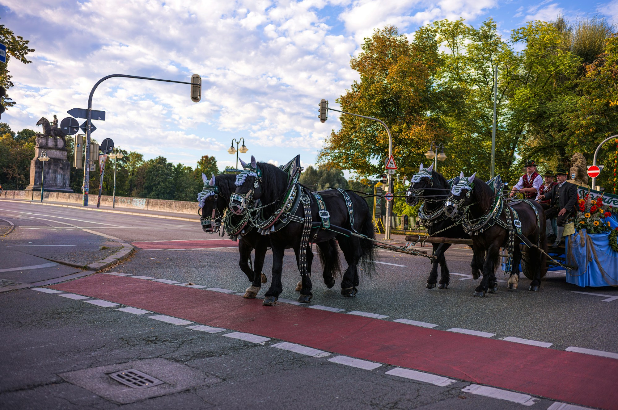 Horse-drawn brewery wagons in a parade at a German folk festival