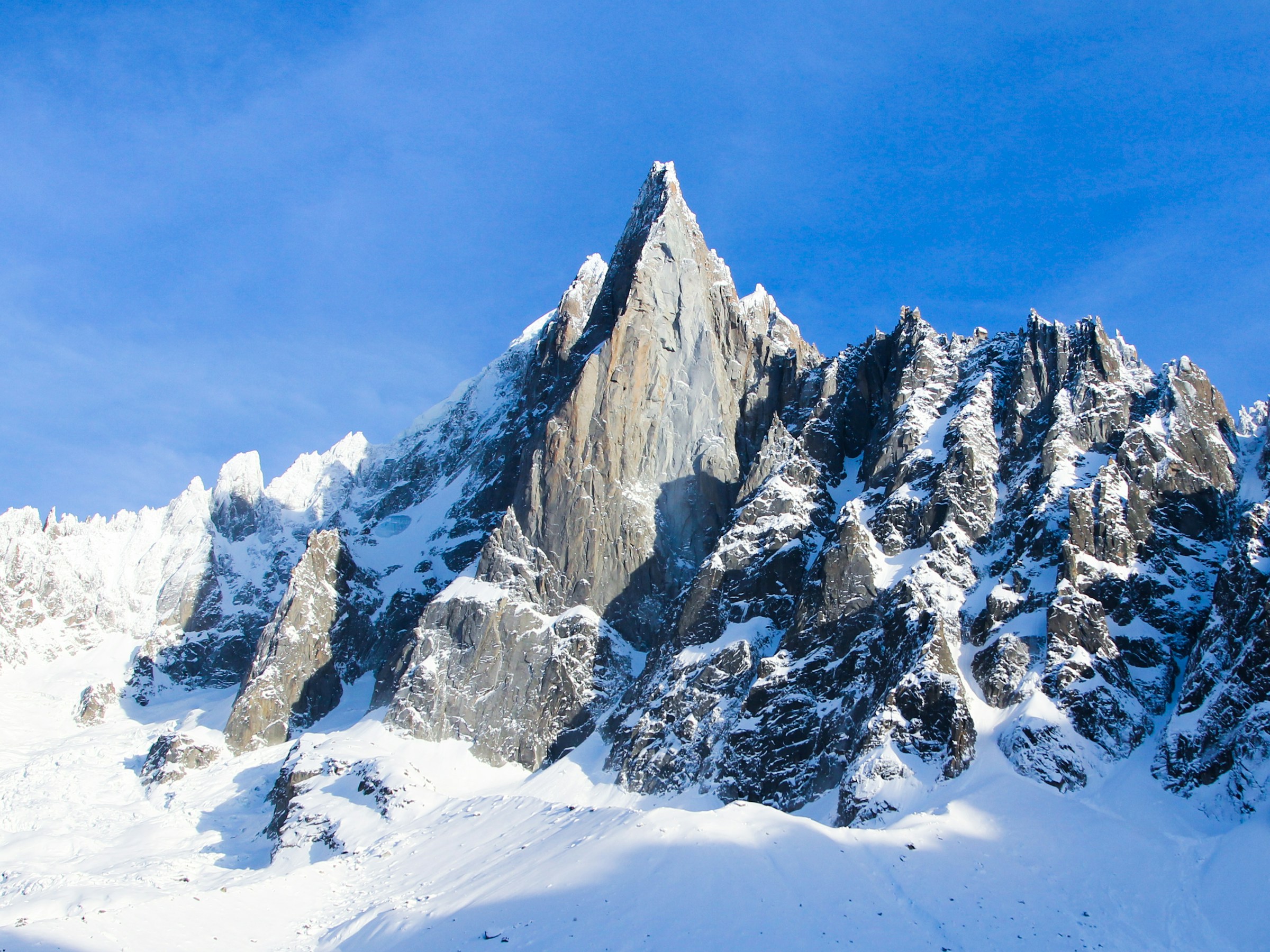 Snow-capped peaks under a blue sky above Chamonix