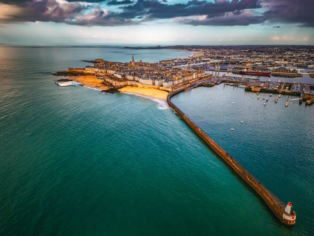 Saint-Malo : Aerial view of a coastal city with a long pier