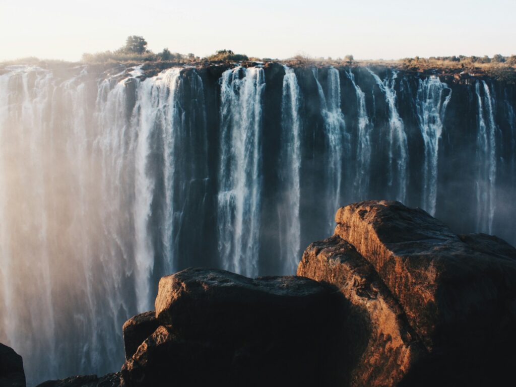 Victoria Falls (Zimbabwe) : water falls on brown rocky mountain during daytime