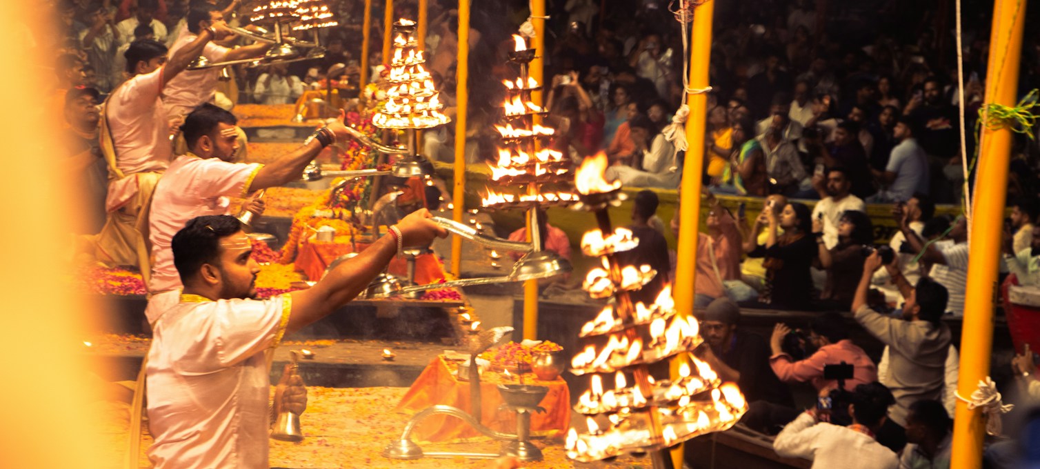 Oil lamps lit at dusk on a ghat in Varanasi