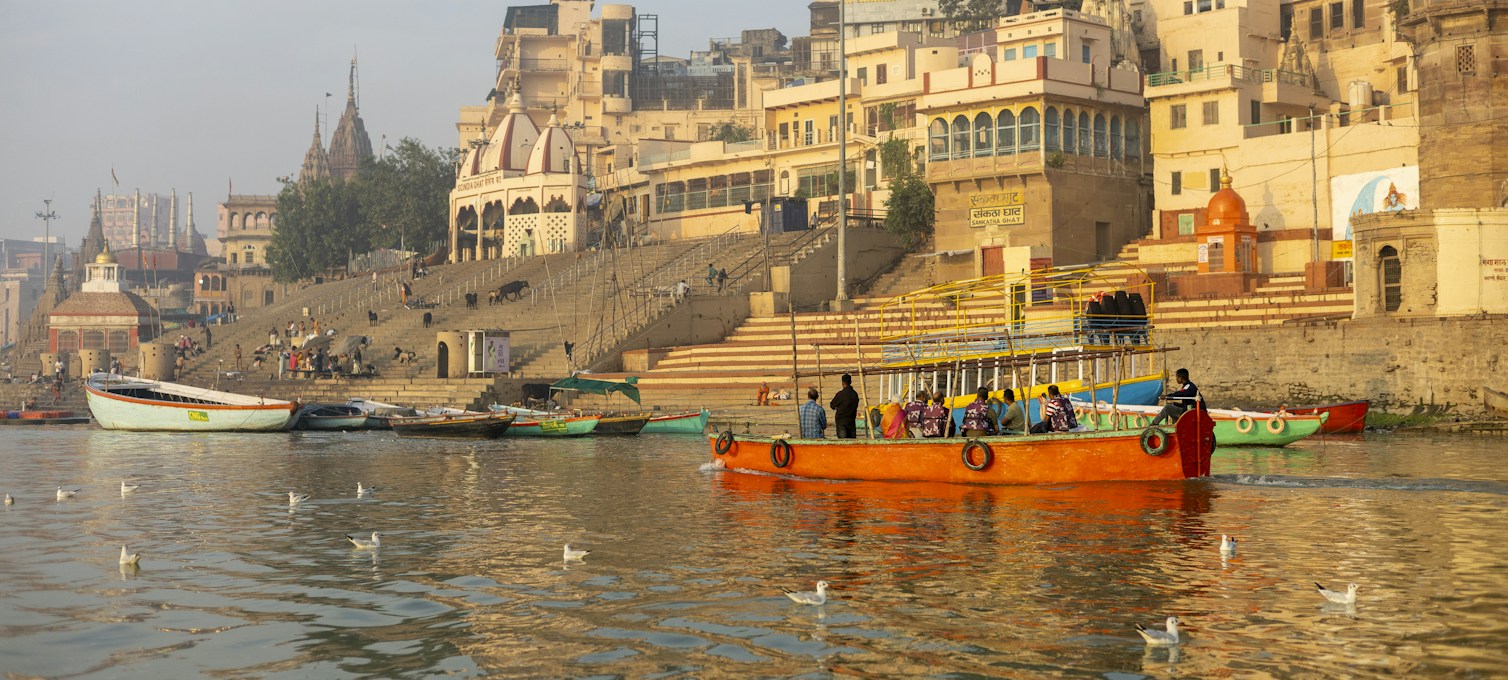 Boats on the Ganges at sunrise in front of the Varanasi ghats