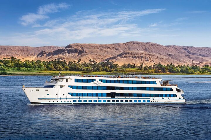 Cruise boat moored on the Nile between Aswan and Luxor at sunset