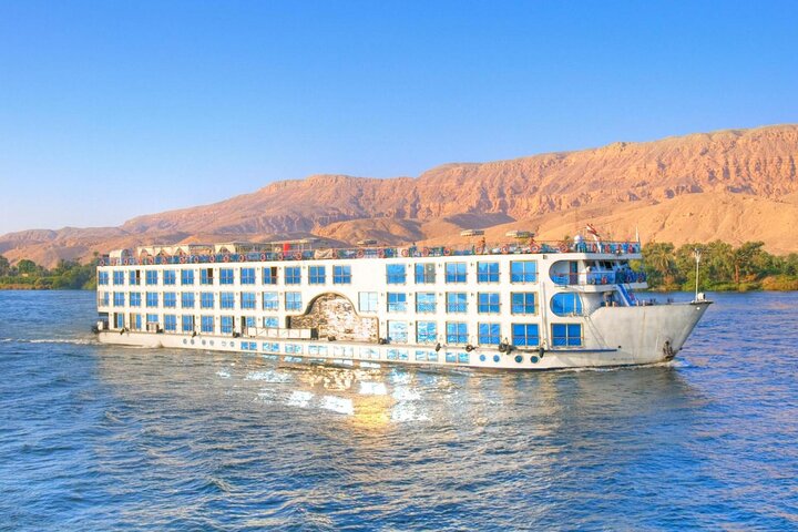 Feluccas and a cruise boat on the Nile off the Luxor shore
