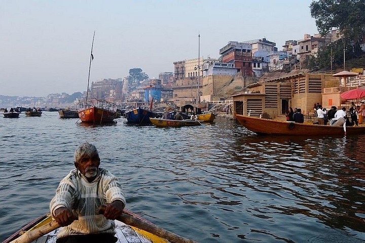 Busy lane in Varanasi old town with a local guide