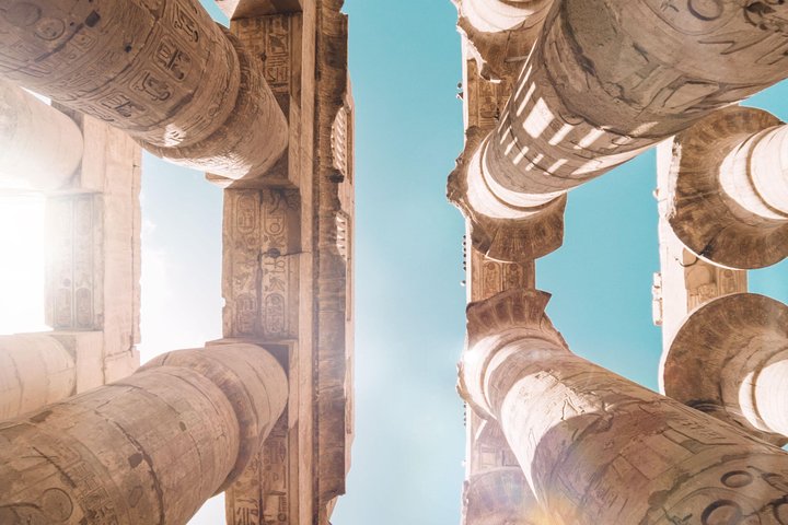 Egyptologist guide in front of a temple on Luxor's east bank during a private visit