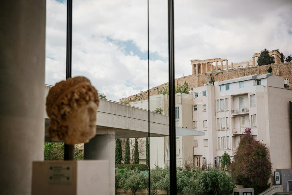 Gallery of the Acropolis Museum with sculptures lit by natural light
