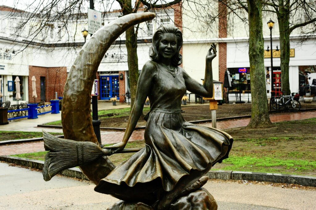 Bronze witch statue on a crescent moon in Salem, Massachusetts