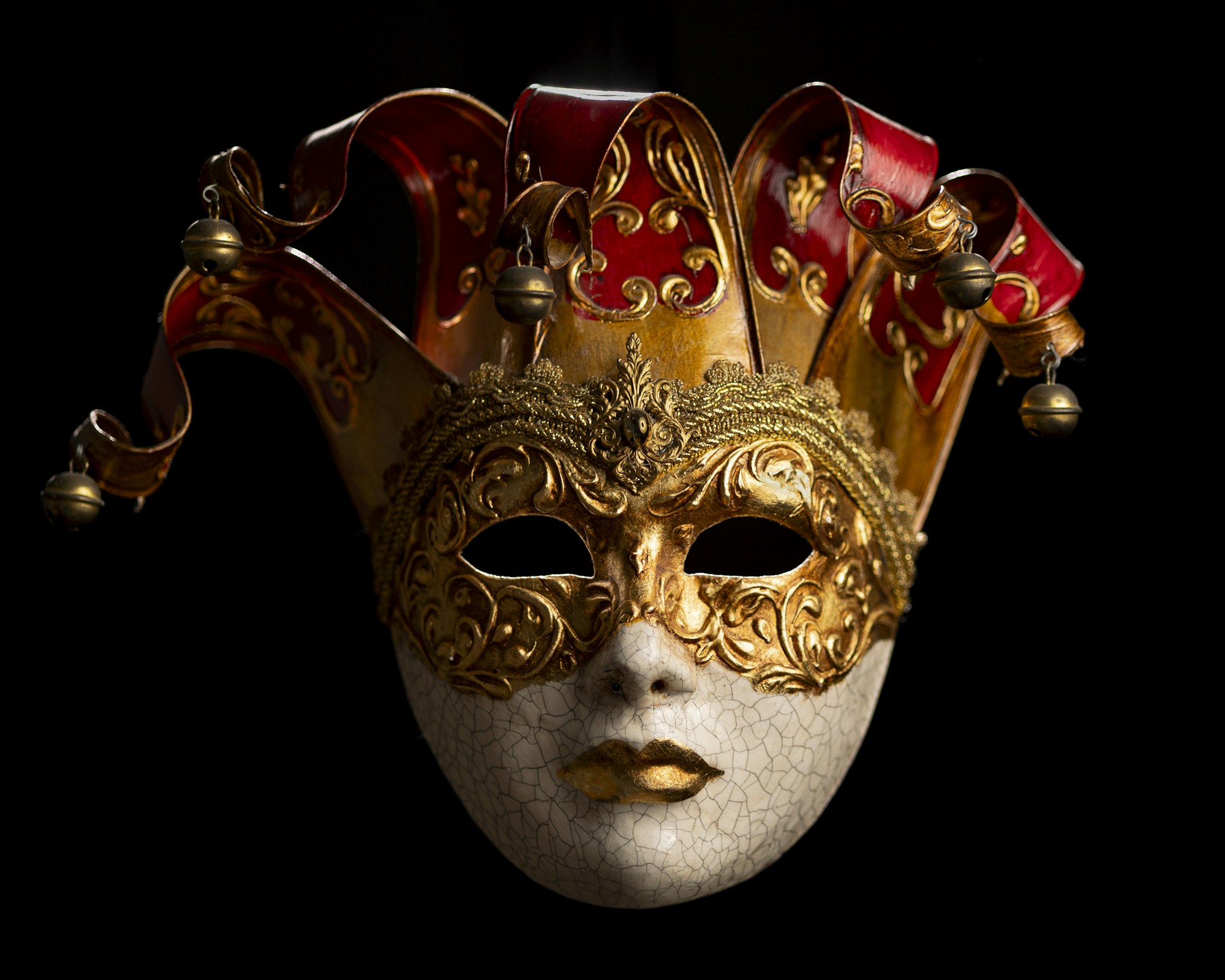 Venetian mask resting under low light