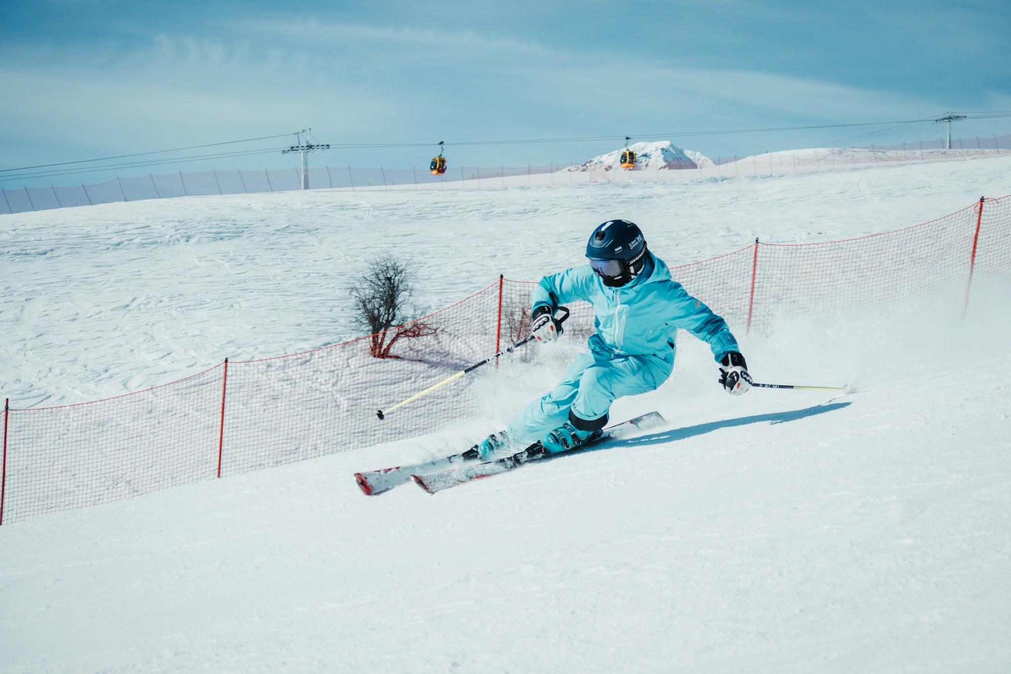 Skier racing down a snowy slope