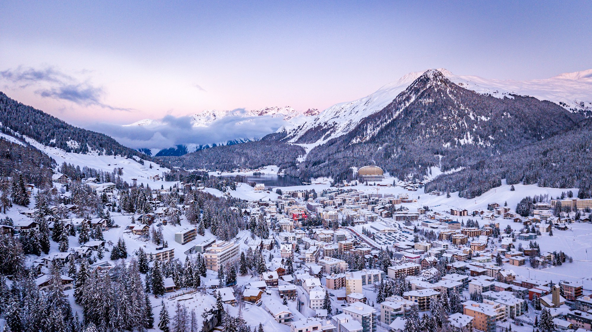 Davos Platz village in winter, snow-covered peaks around the resort
