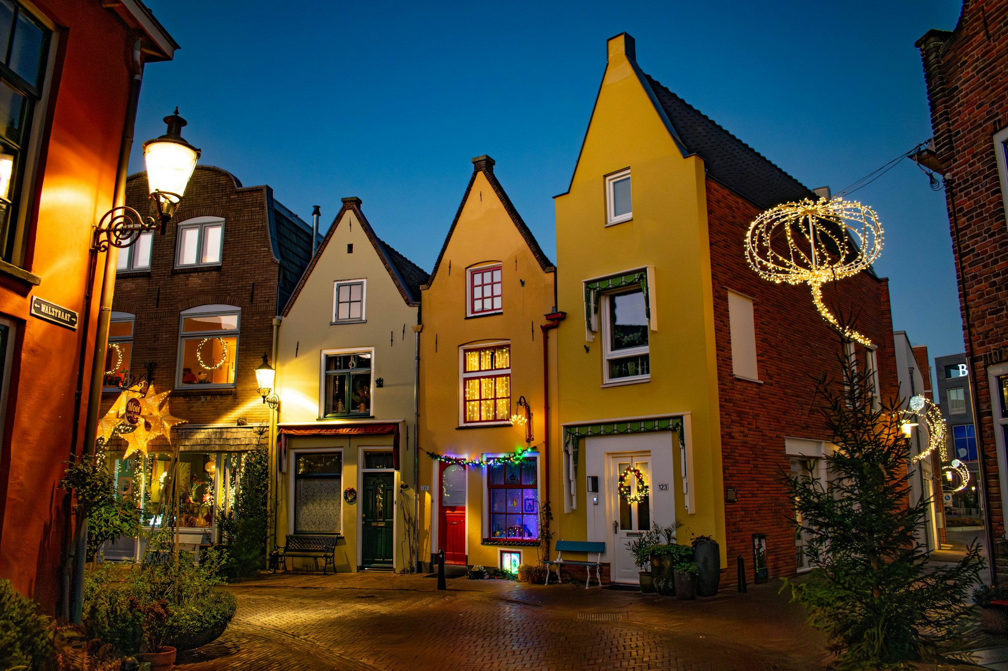 Street in Deventer lit up at dusk during the Christmas festivities