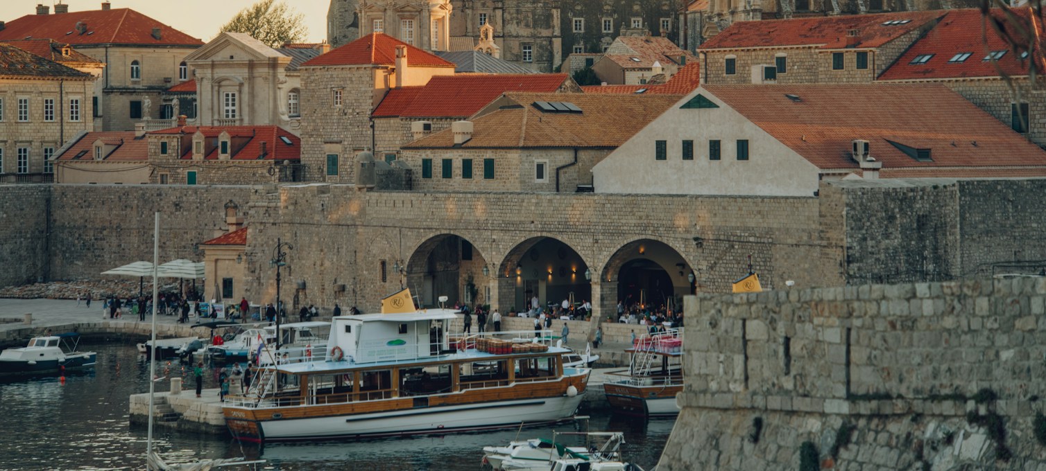 Boats moored in a harbor near Dubrovnik's Old Town