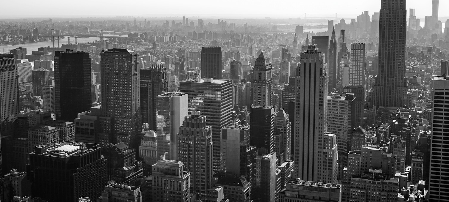 Manhattan skyline with the Empire State Building at the end of the day