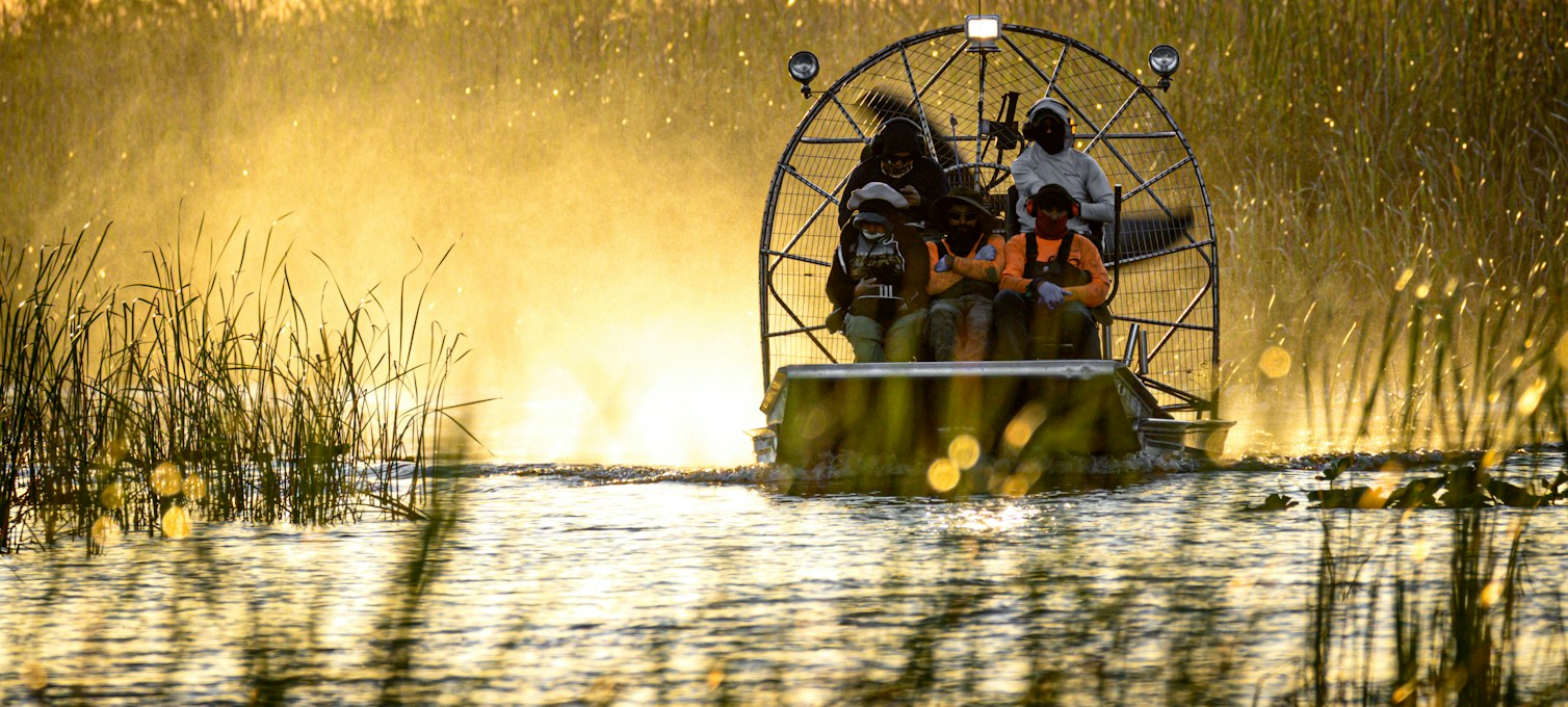 Airboat on a canal through sawgrass in the Everglades