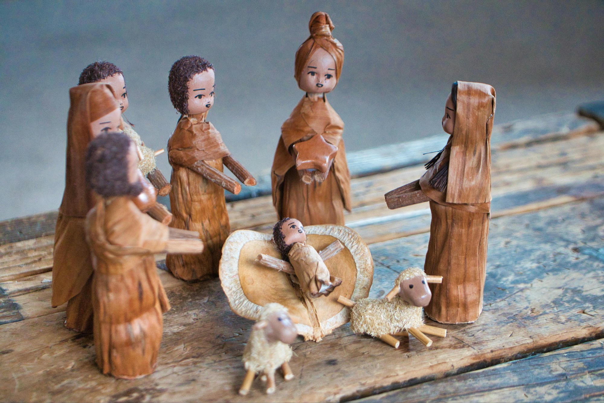 Wooden nativity figurines with sheep