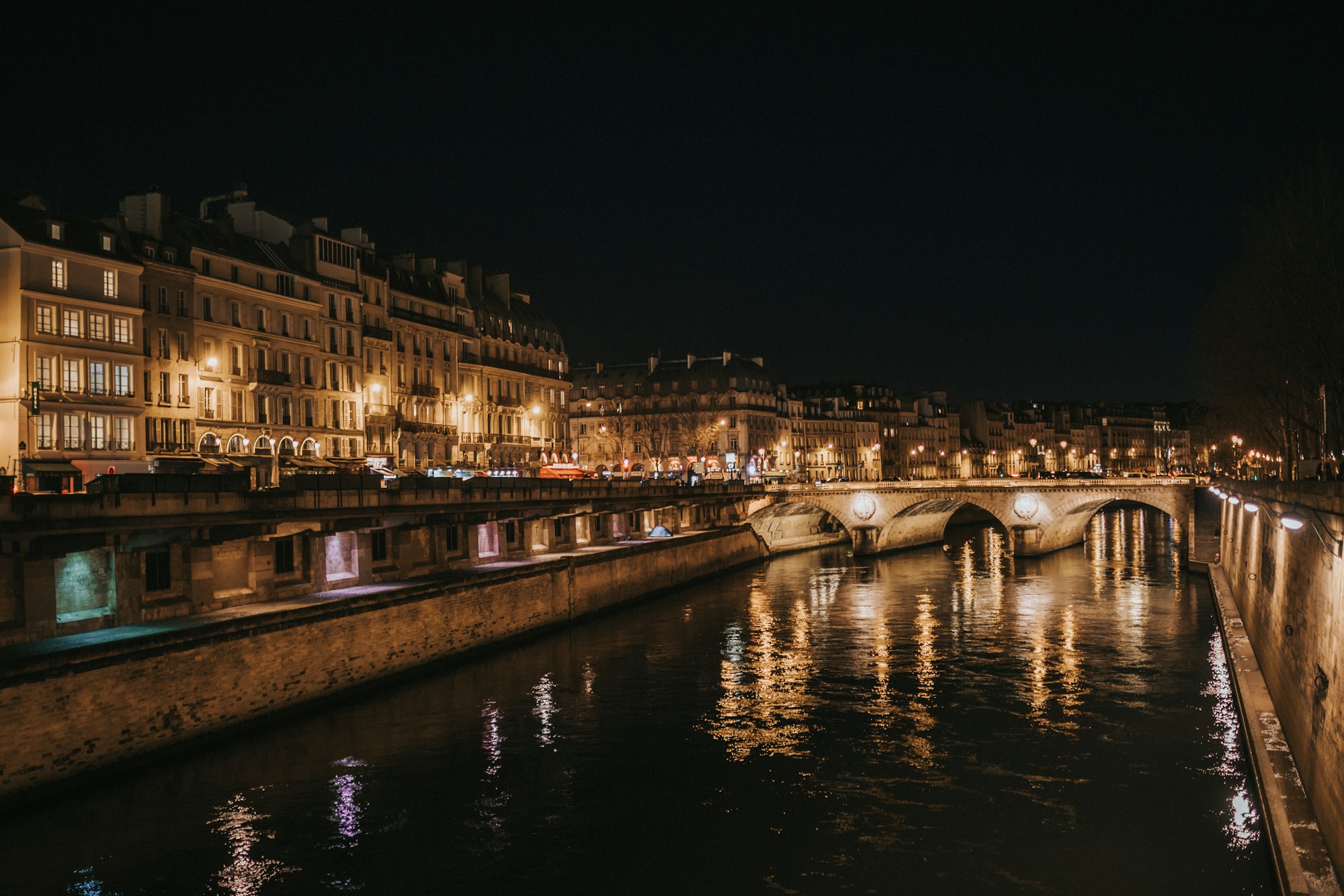 Paris lit up at night, Seine embankments and illuminated monuments