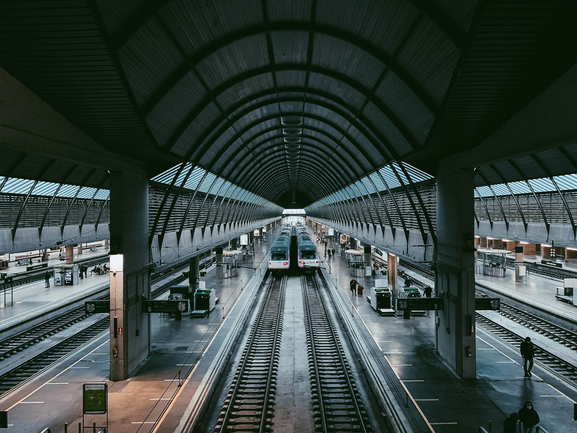 Platform at a Spanish railway station with a high-speed train stopped at the platform