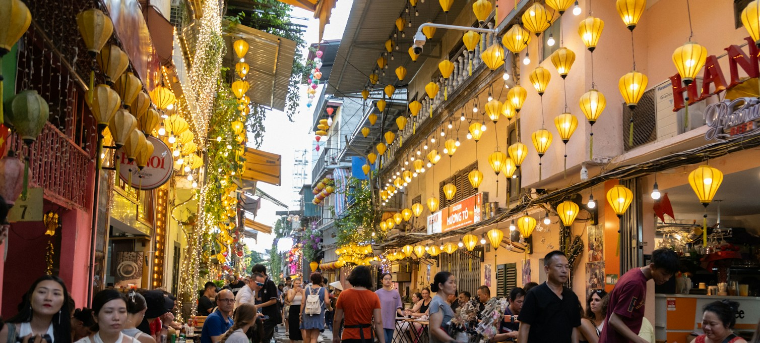 Hanoi train street, lined with lanterns and terraces