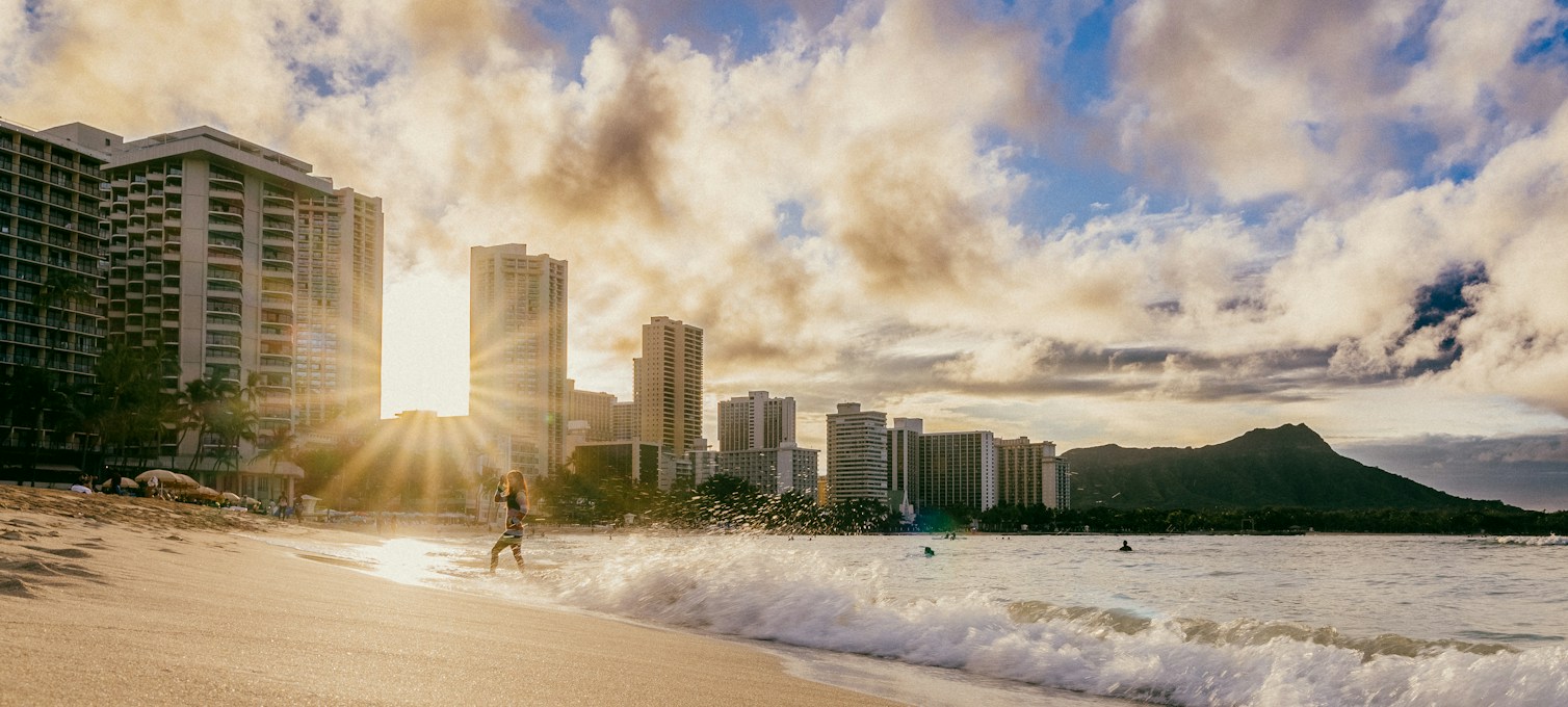 Sandy beach and clear water in Waikiki early in the morning