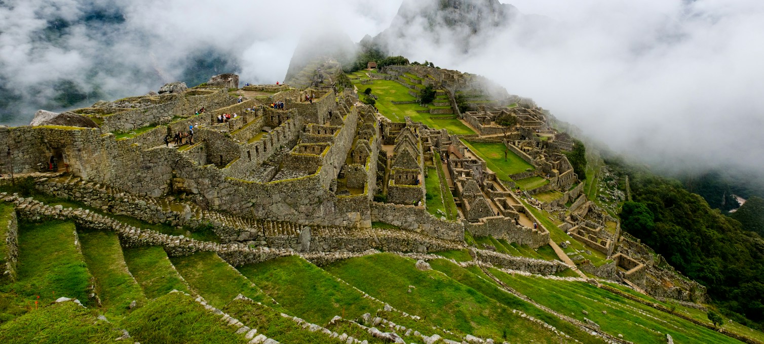 Machu Picchu citadel and Huayna Picchu in the morning mist
